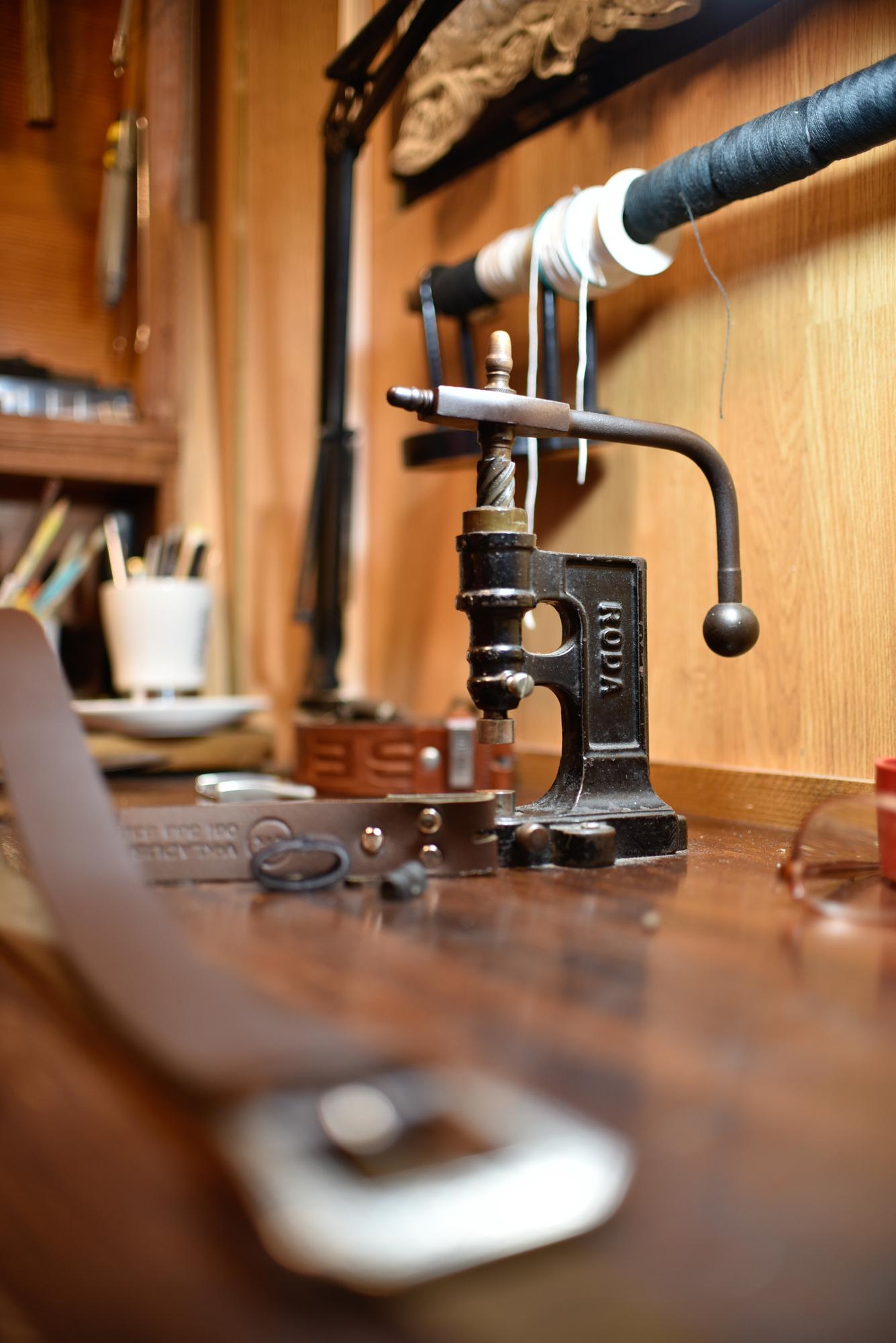 Workshop interior with embroidery machines and fabrics