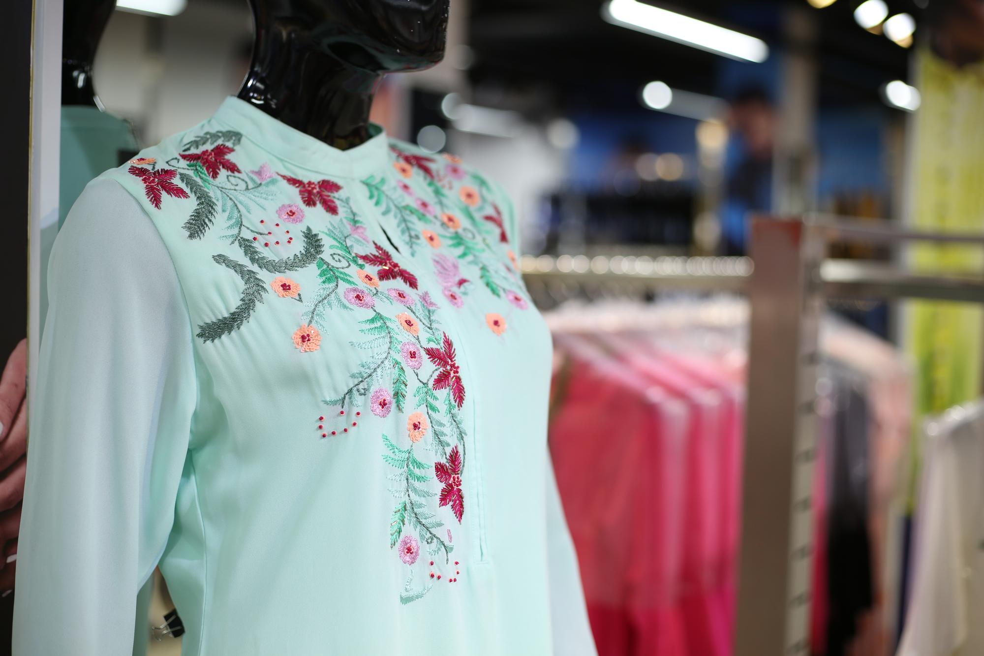 Finished embroidered garment on mannequin